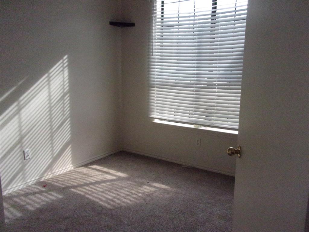 1511 Spanish Oak Drive Granbury, TX 76048 - Photo 6 of 16 an empty room with a window