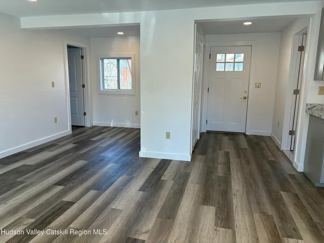 wooden floor in a hall with an entryway