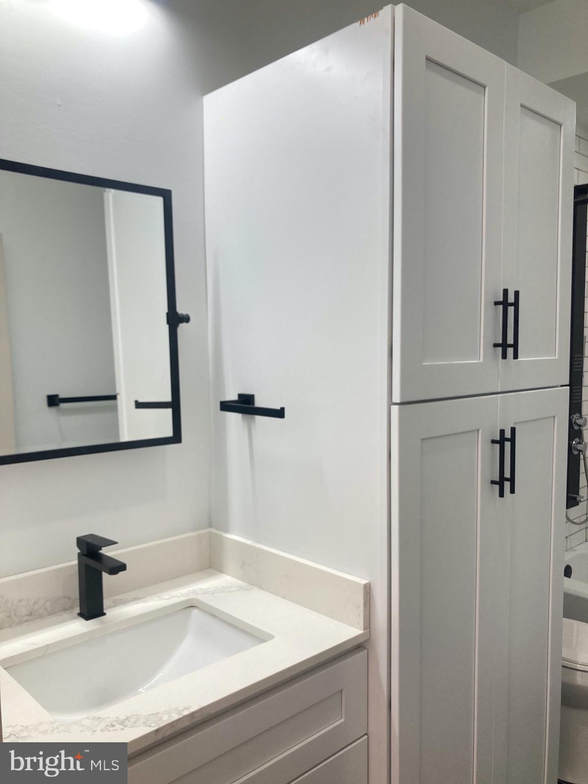 1901 West Diamond Street, Unit 2 Philadelphia, PA 19121 - Photo 6 of 9 a bathroom with a sink and a mirror