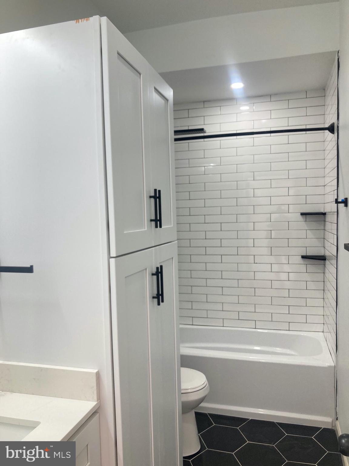 1901 West Diamond Street, Unit 2 Philadelphia, PA 19121 - Photo 7 of 9 a bathroom with a bathtub and a shower