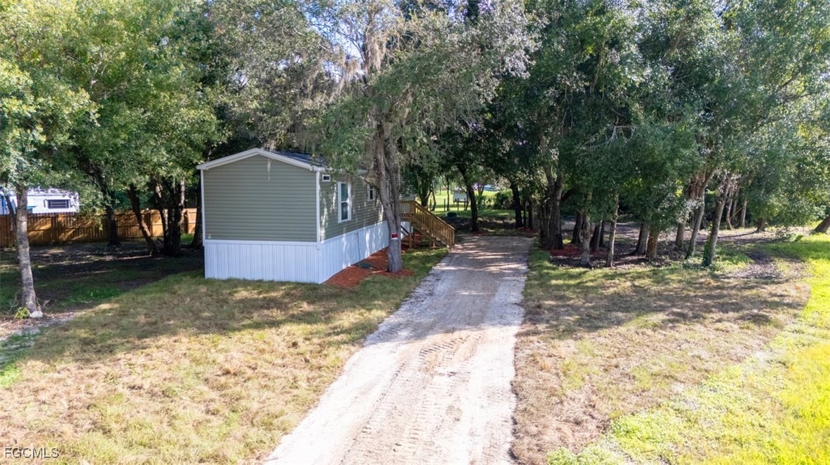 1603 Horseshoe Loop Moore Haven, FL 33471 - Photo 3 of 27 a view of a house with a yard