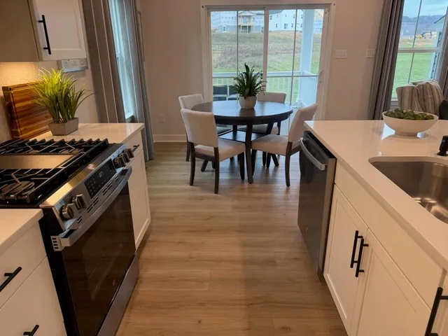 a dining room with furniture and window