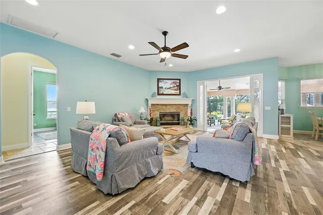 a kitchen with stainless steel appliances granite countertop a sink and a refrigerator