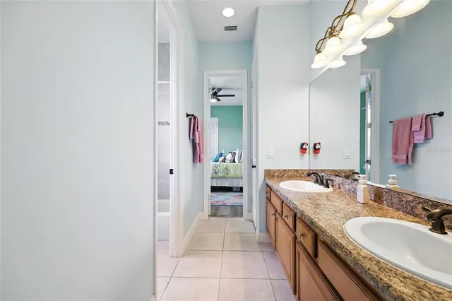 a bedroom with a bed and flat screen tv