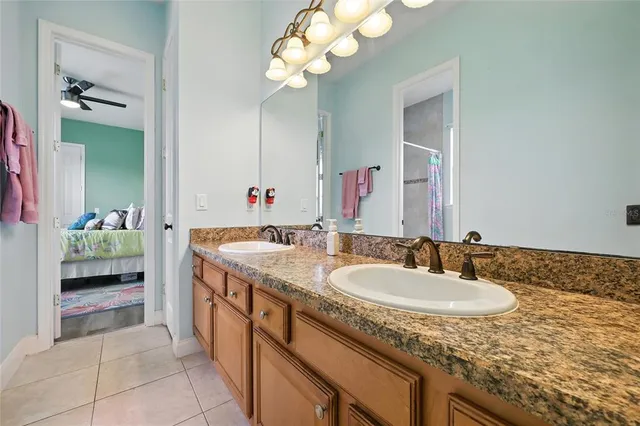 a kitchen with stainless steel appliances granite countertop a sink a stove and cabinets