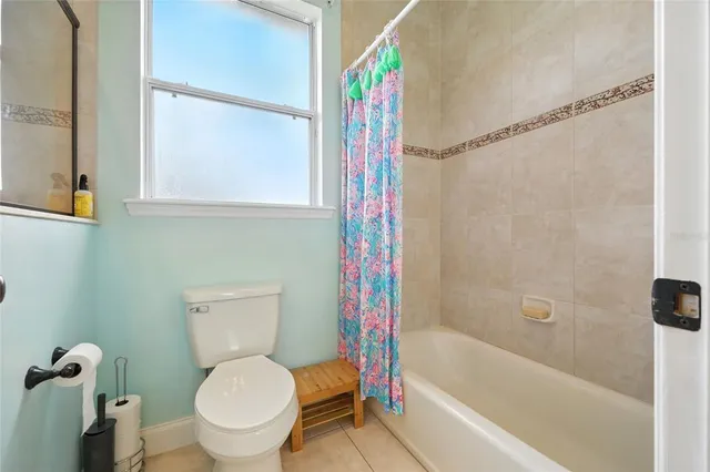 a living room with a bed and furniture