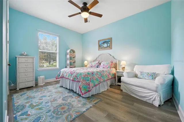 a bathroom with a granite countertop sink a large mirror and vanity
