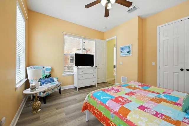 a very nice looking living room with dining room and wooden floor