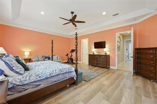 a view of a patio with dining table and chairs under an umbrella