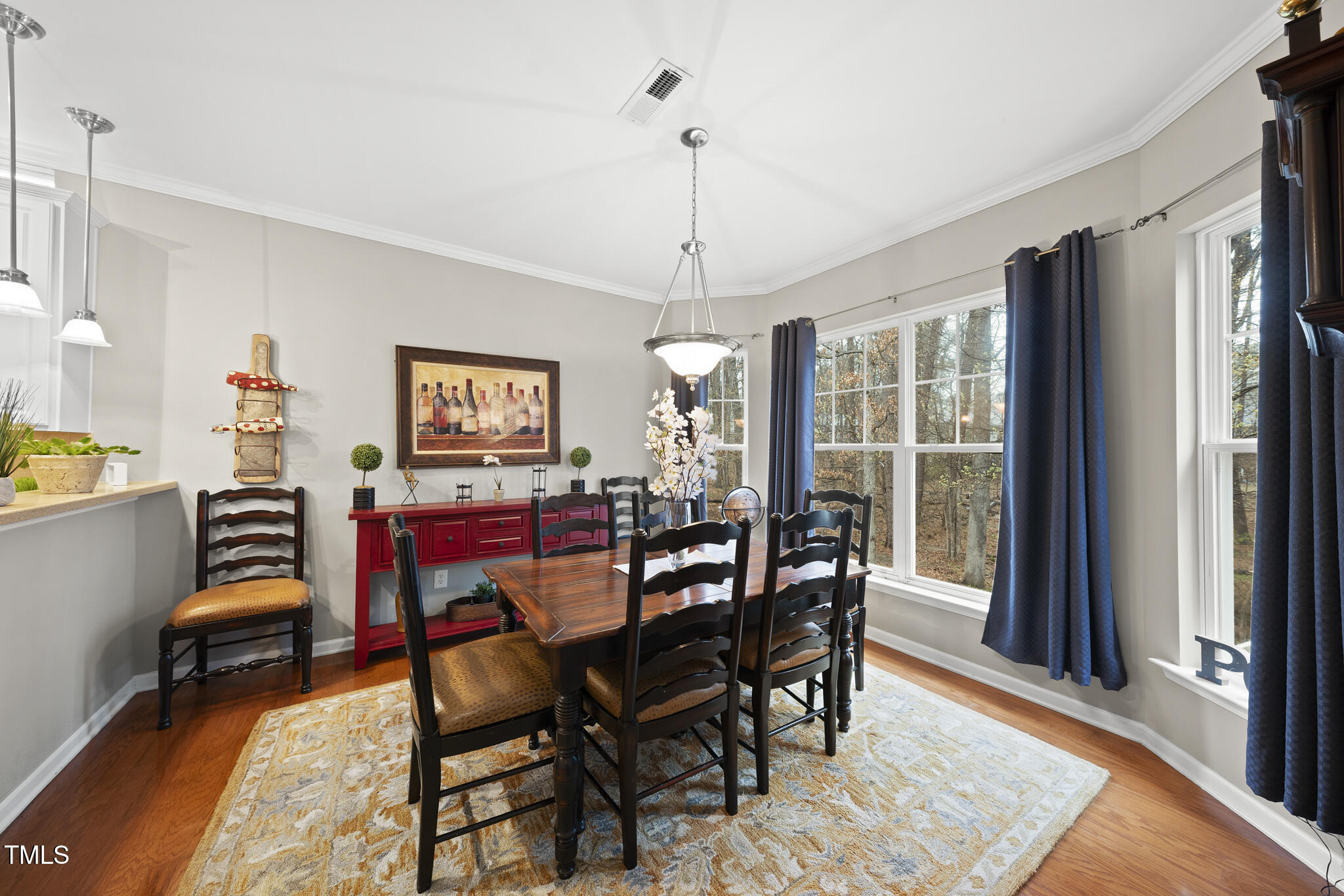 3419 Ranbir Drive Durham, NC 27713 - Photo 13 of 33 a view of a dining room with furniture window and wooden floor