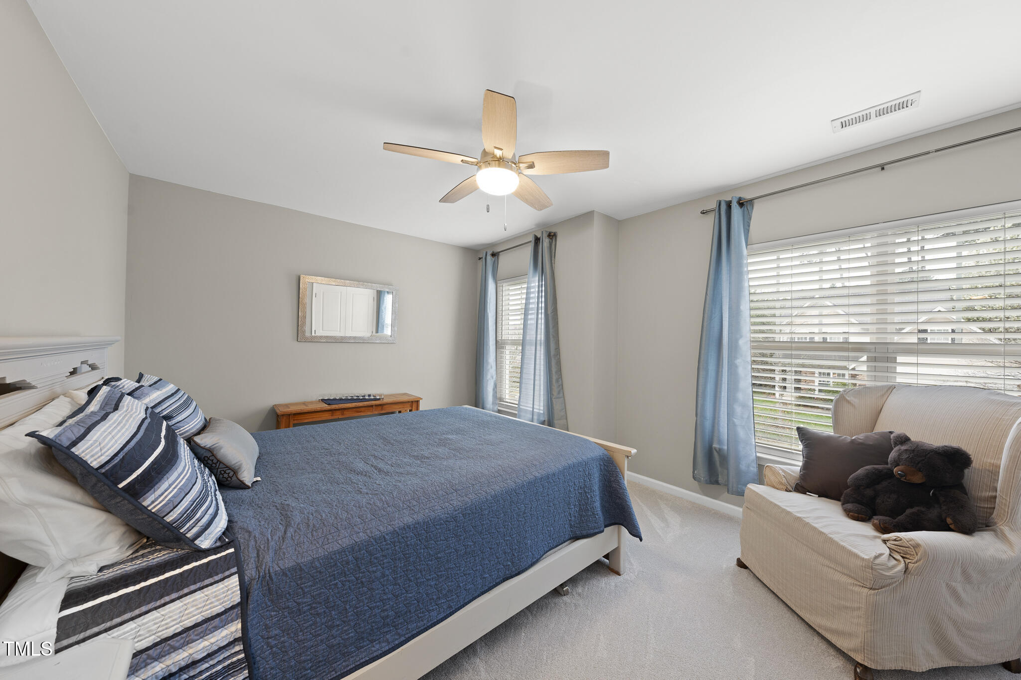 3419 Ranbir Drive Durham, NC 27713 - Photo 23 of 33 a bedroom with a bed and wooden floor