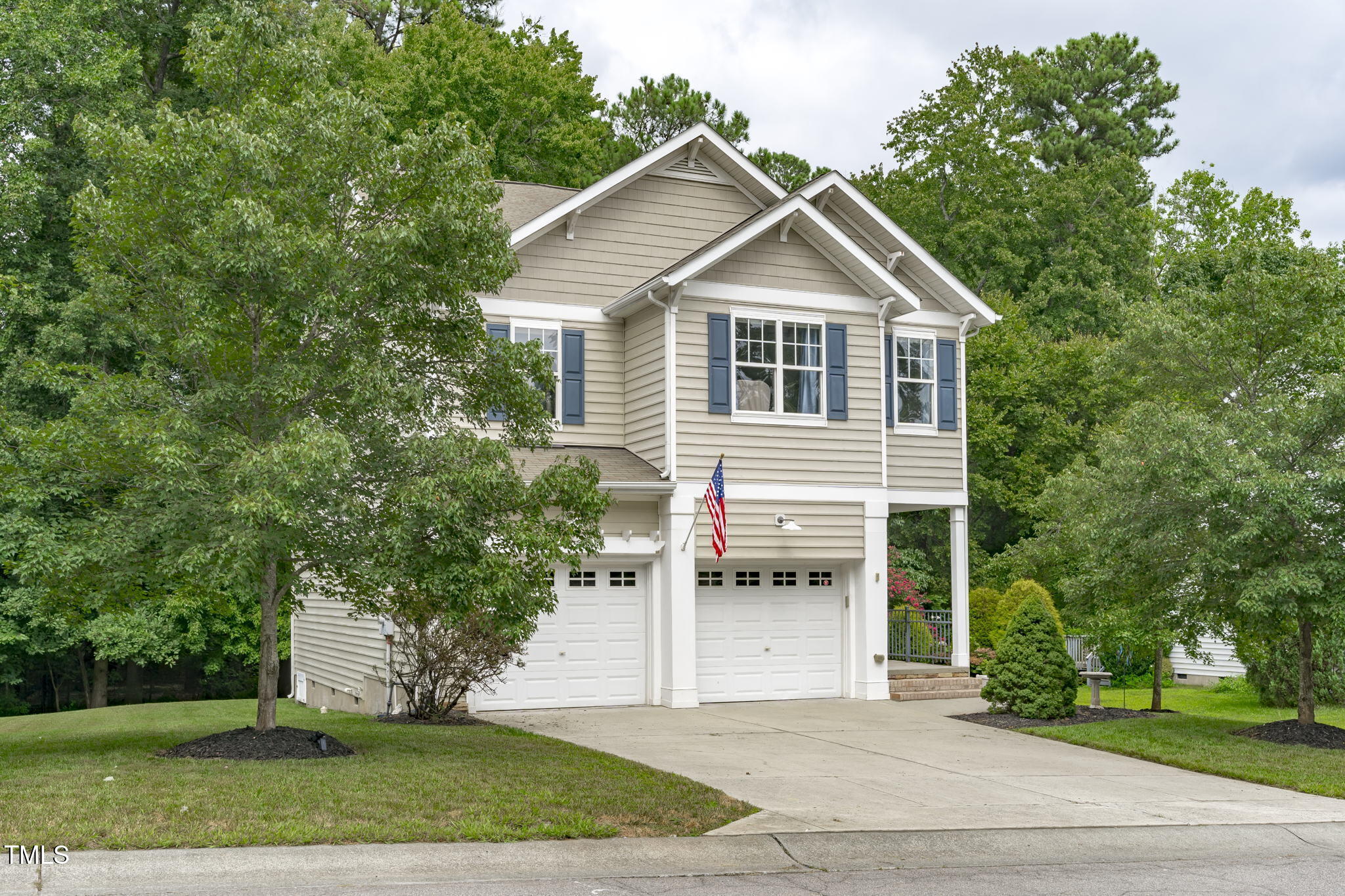 3419 Ranbir Drive Durham, NC 27713 - Photo 2 of 33 a front view of a house with a yard and trees