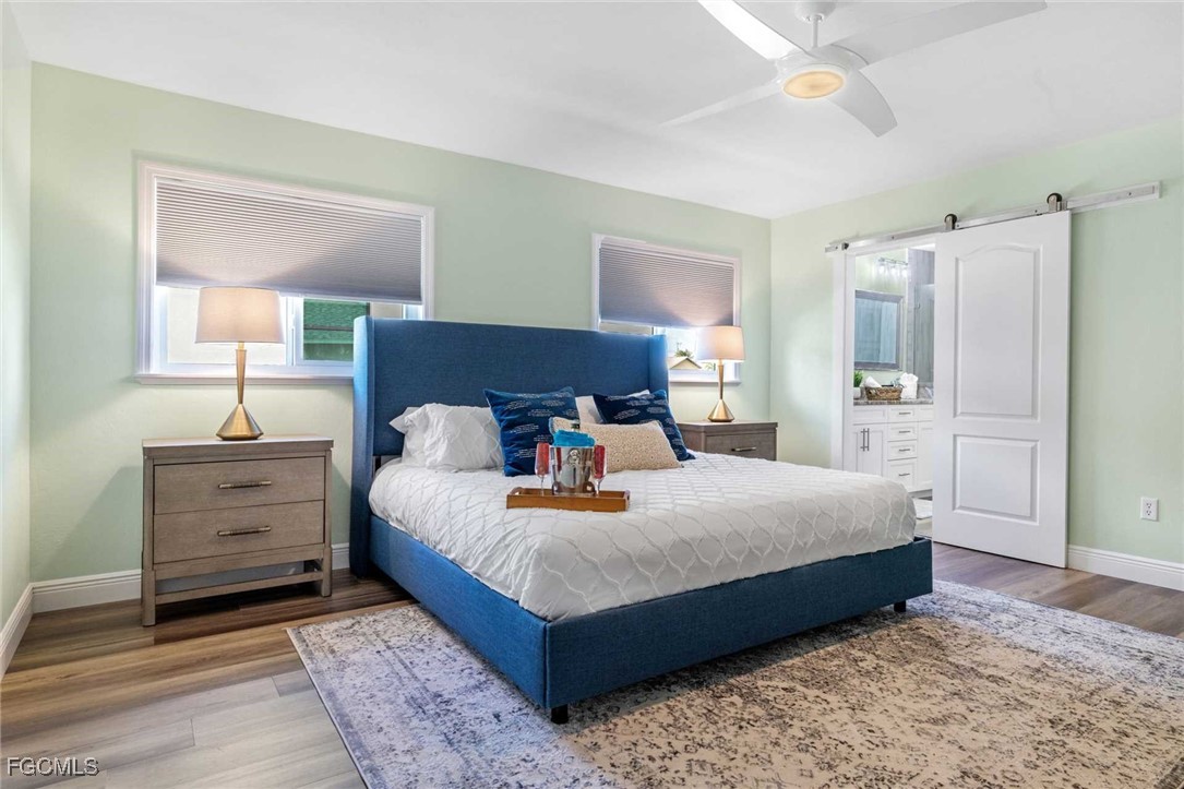 2307 Southwest 40th Street Cape Coral, FL 33914 - Photo 12 of 36 a bedroom with a bed and window