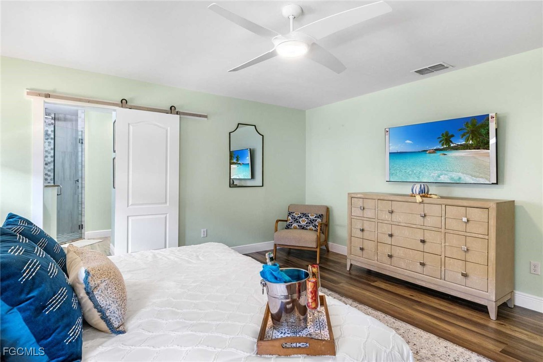 2307 Southwest 40th Street Cape Coral, FL 33914 - Photo 14 of 36 a bed room with a bed and a dresser