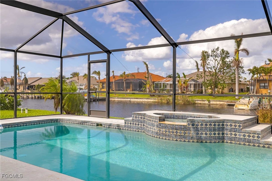 2307 Southwest 40th Street Cape Coral, FL 33914 - Photo 21 of 36 a view of a swimming pool with a porch