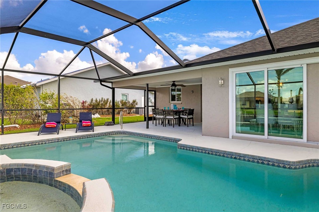 2307 Southwest 40th Street Cape Coral, FL 33914 - Photo 23 of 36 a swimming pool with outdoor seating