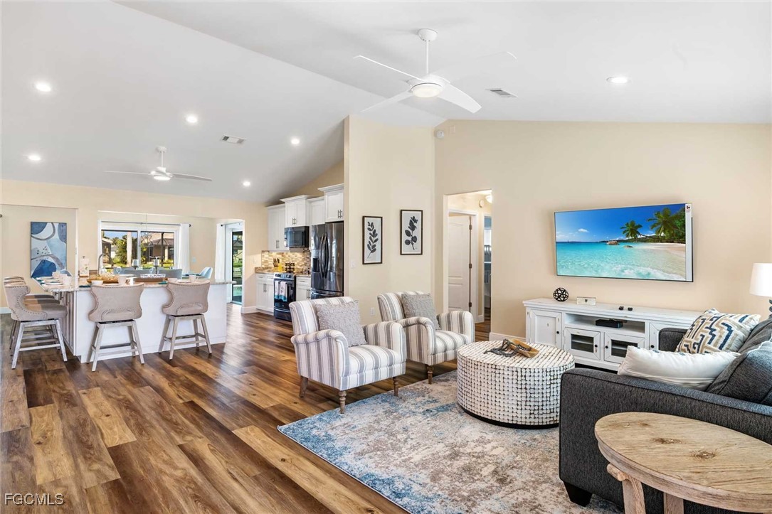 2307 Southwest 40th Street Cape Coral, FL 33914 - Photo 26 of 36 a living room with furniture and a wooden floor