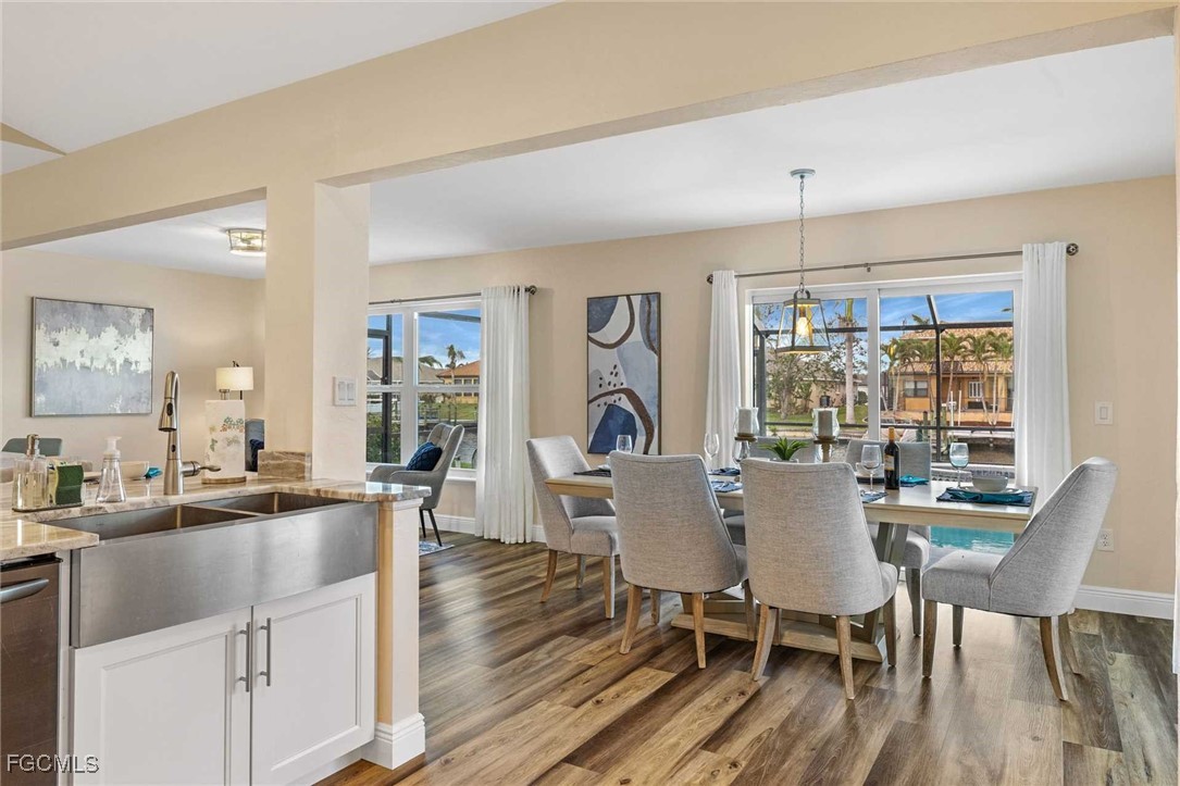 2307 Southwest 40th Street Cape Coral, FL 33914 - Photo 35 of 36 a view of a dining room with furniture window and wooden floor