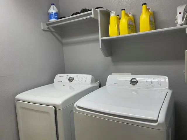 a utility room with dryer and washer