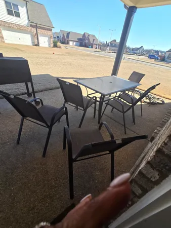 a view of a terrace with wooden floor and outdoor seating