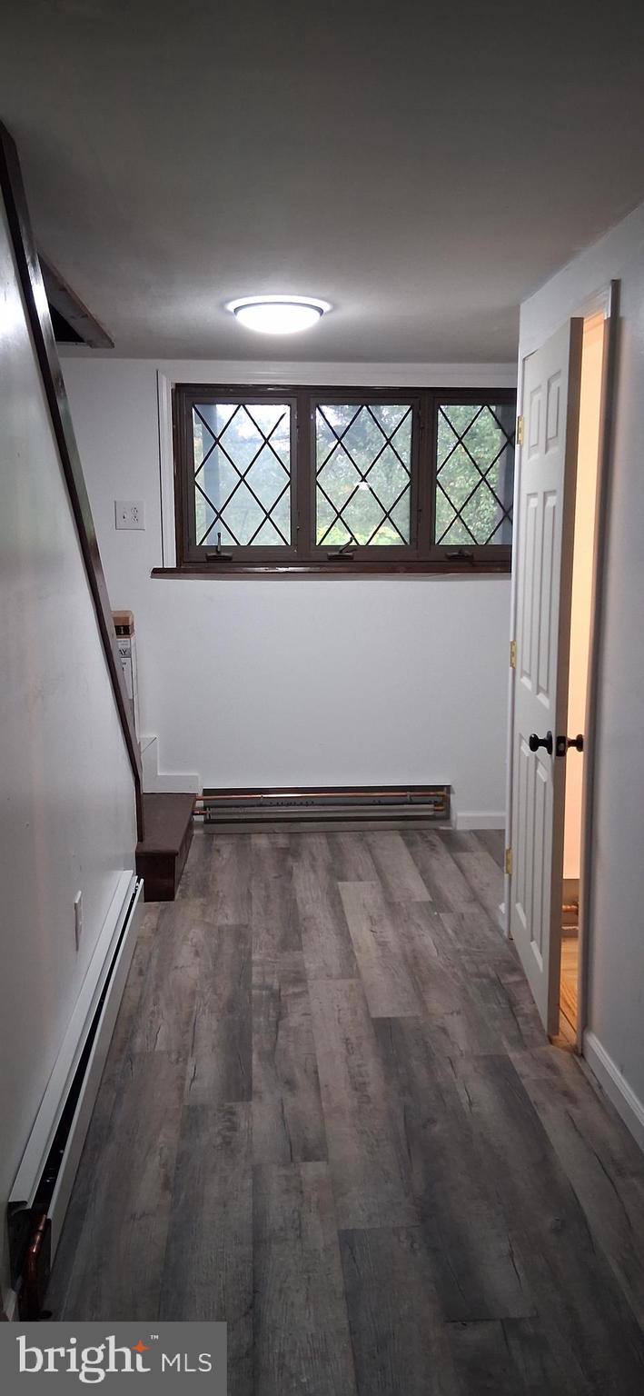 139 Church Street Twin Rocks, PA 15960 - Photo 11 of 47 wooden floor in an empty room with a window