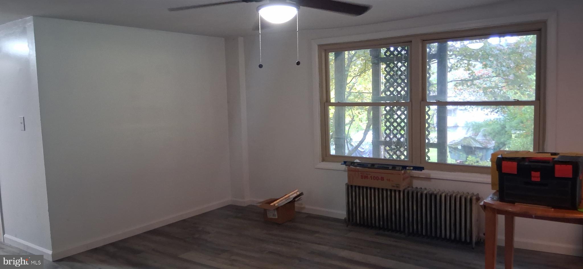 139 Church Street Twin Rocks, PA 15960 - Photo 12 of 47 a view of a room with a window and wooden floor