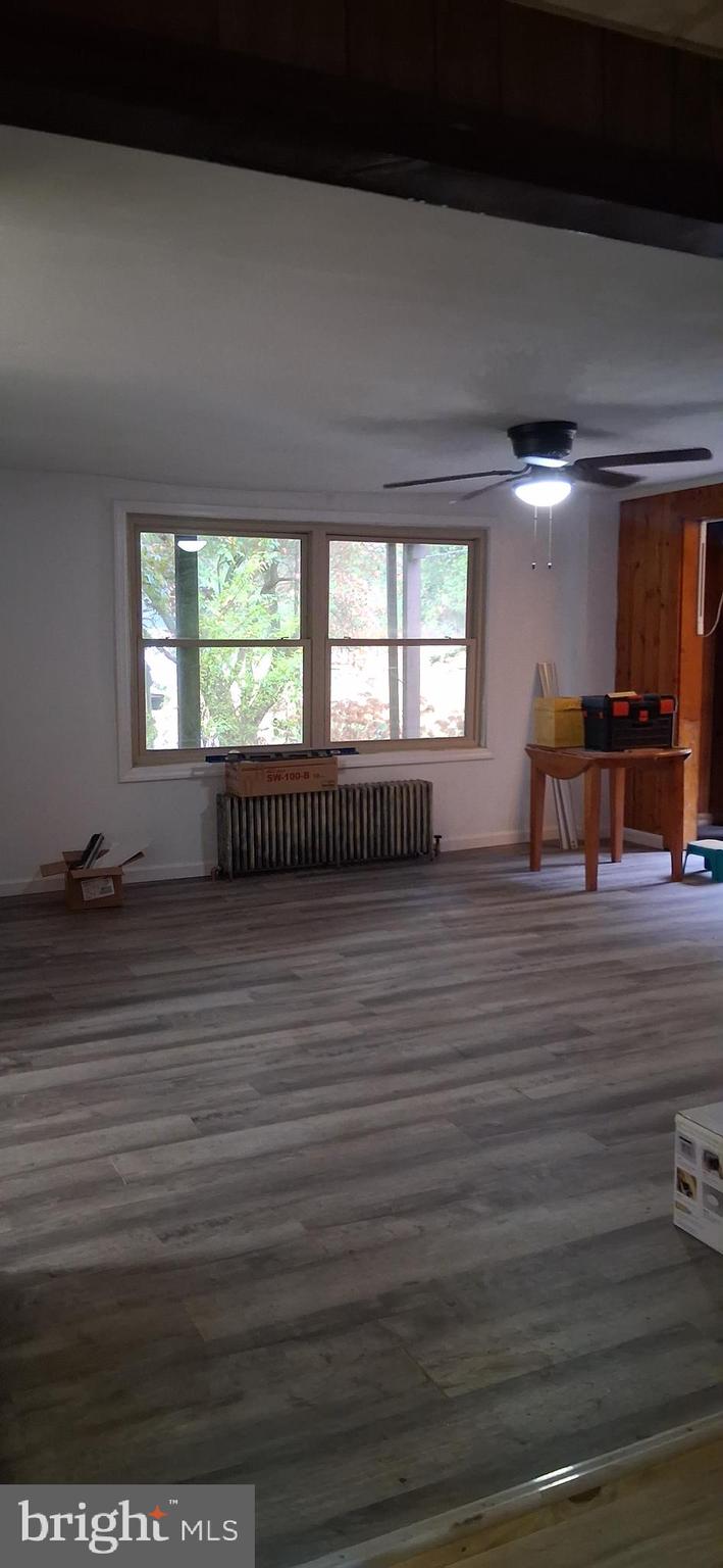 139 Church Street Twin Rocks, PA 15960 - Photo 13 of 47 an empty room with wooden floor and windows