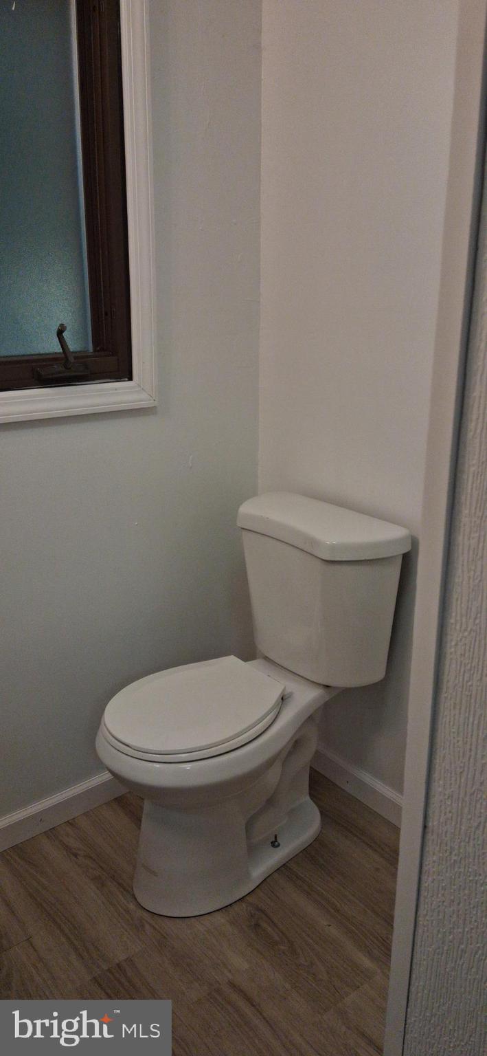 139 Church Street Twin Rocks, PA 15960 - Photo 16 of 47 a white toilet sitting next to a white sink and vanity