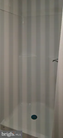 a view of an empty room with a fireplace