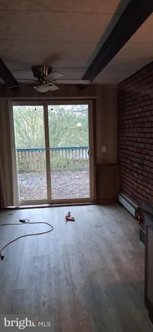 a kitchen with granite countertop a sink a stove and refrigerator