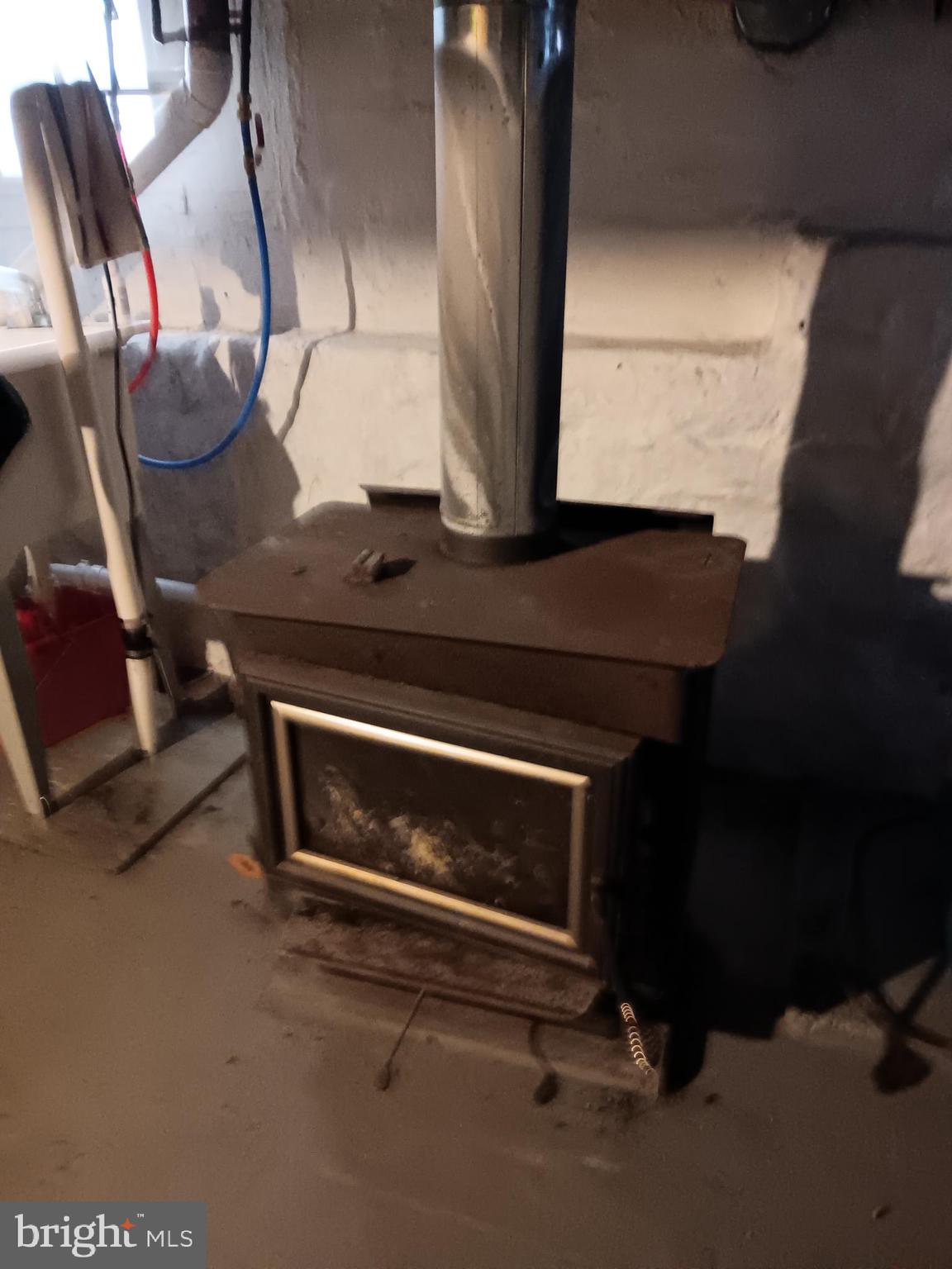 139 Church Street Twin Rocks, PA 15960 - Photo 46 of 47 a living room with chairs and a fireplace