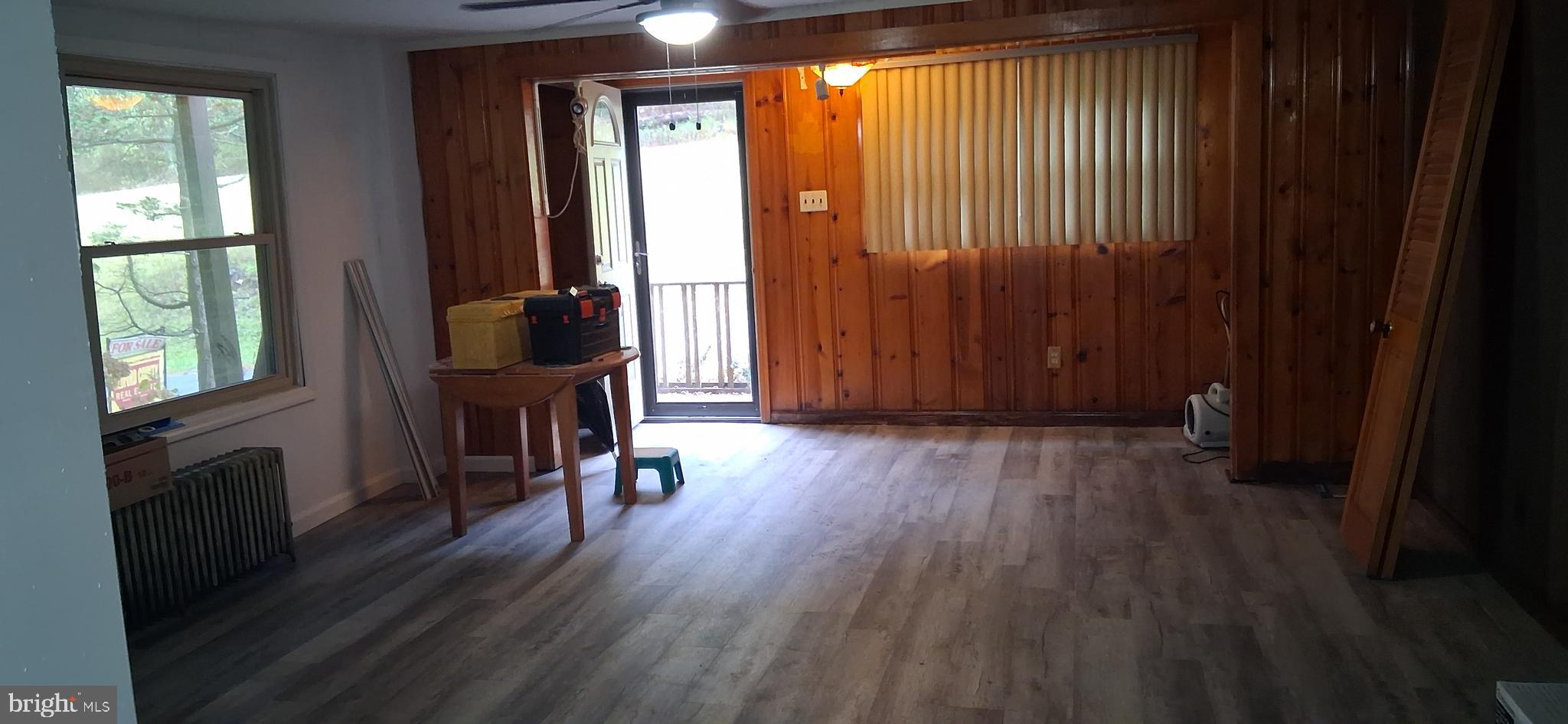 139 Church Street Twin Rocks, PA 15960 - Photo 10 of 47 an empty room with wooden floor and windows