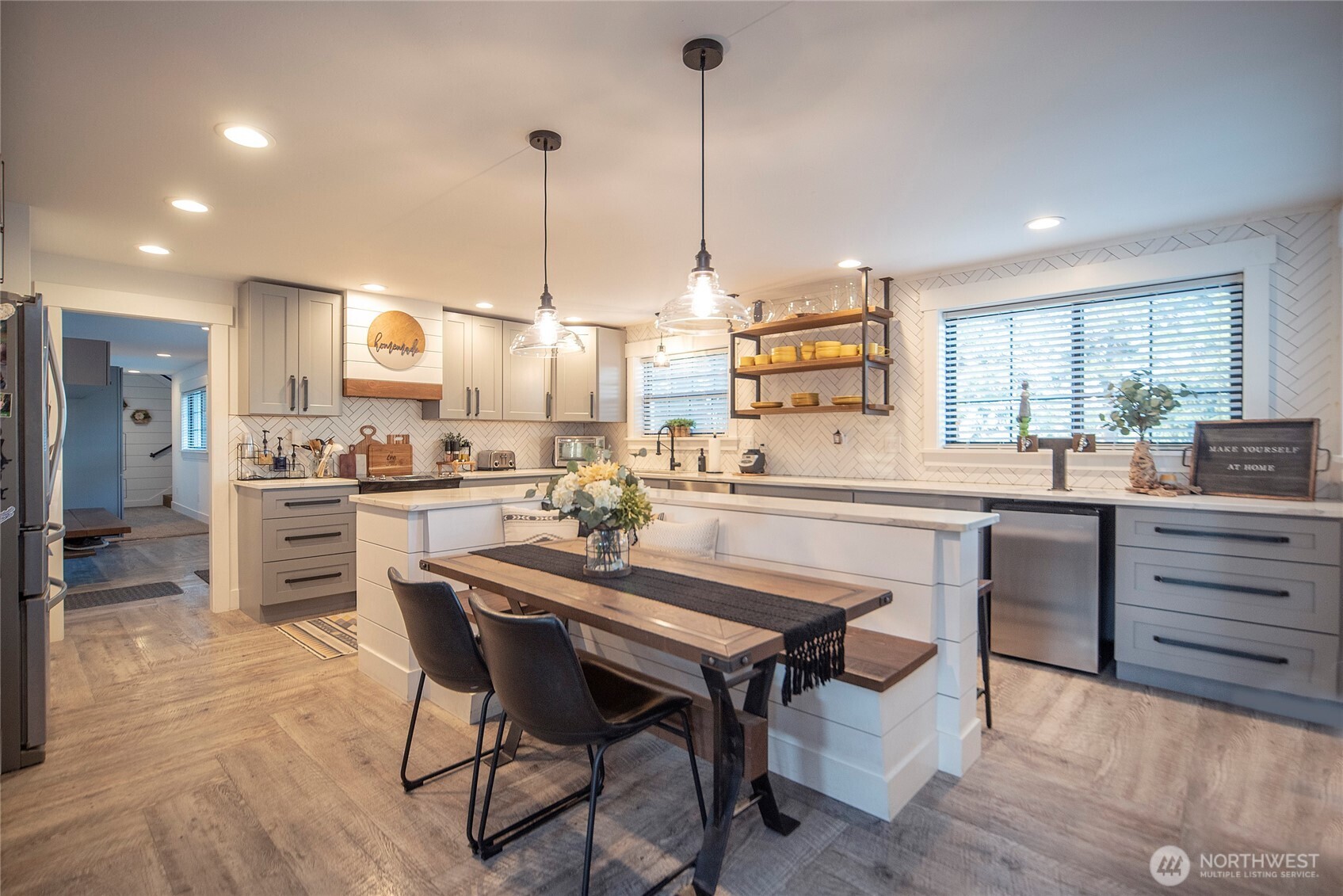 110 Brown Road Ellensburg, WA 98926 - Photo 11 of 40 a kitchen with a table chairs refrigerator and cabinets