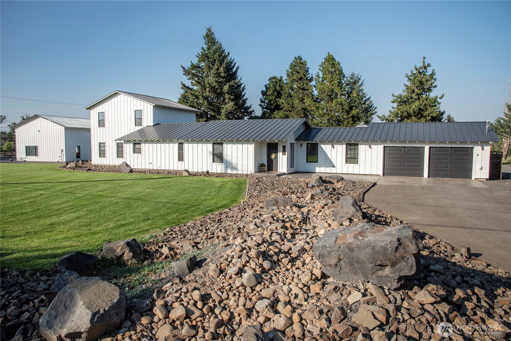 110 Brown Road Ellensburg, WA 98926 - Photo 2 of 40 a front view of a house with a garden