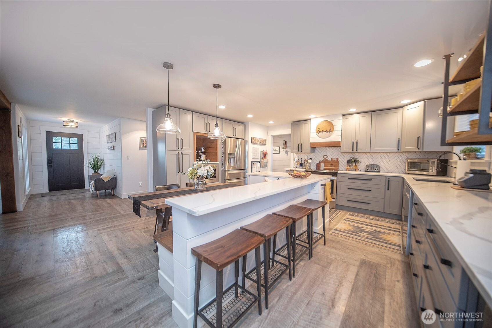110 Brown Road Ellensburg, WA 98926 - Photo 6 of 40 a kitchen with stainless steel appliances granite countertop a table chairs a sink and a refrigerator