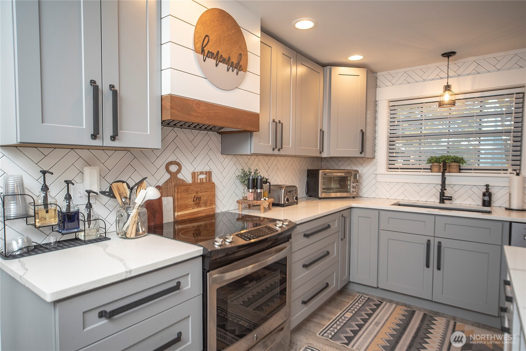110 Brown Road Ellensburg, WA 98926 - Photo 9 of 40 a kitchen with granite countertop a sink stainless steel appliances and cabinets