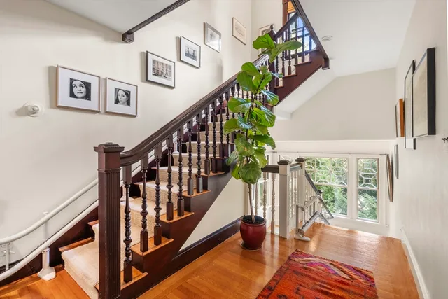 a view of an entryway with wooden floor and stairs