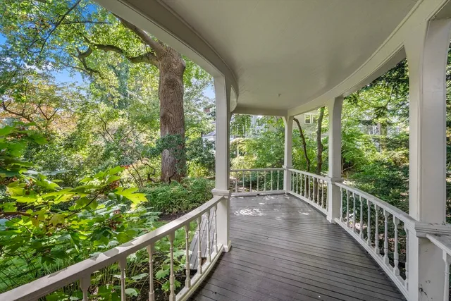 a view of a balcony with wooden floor