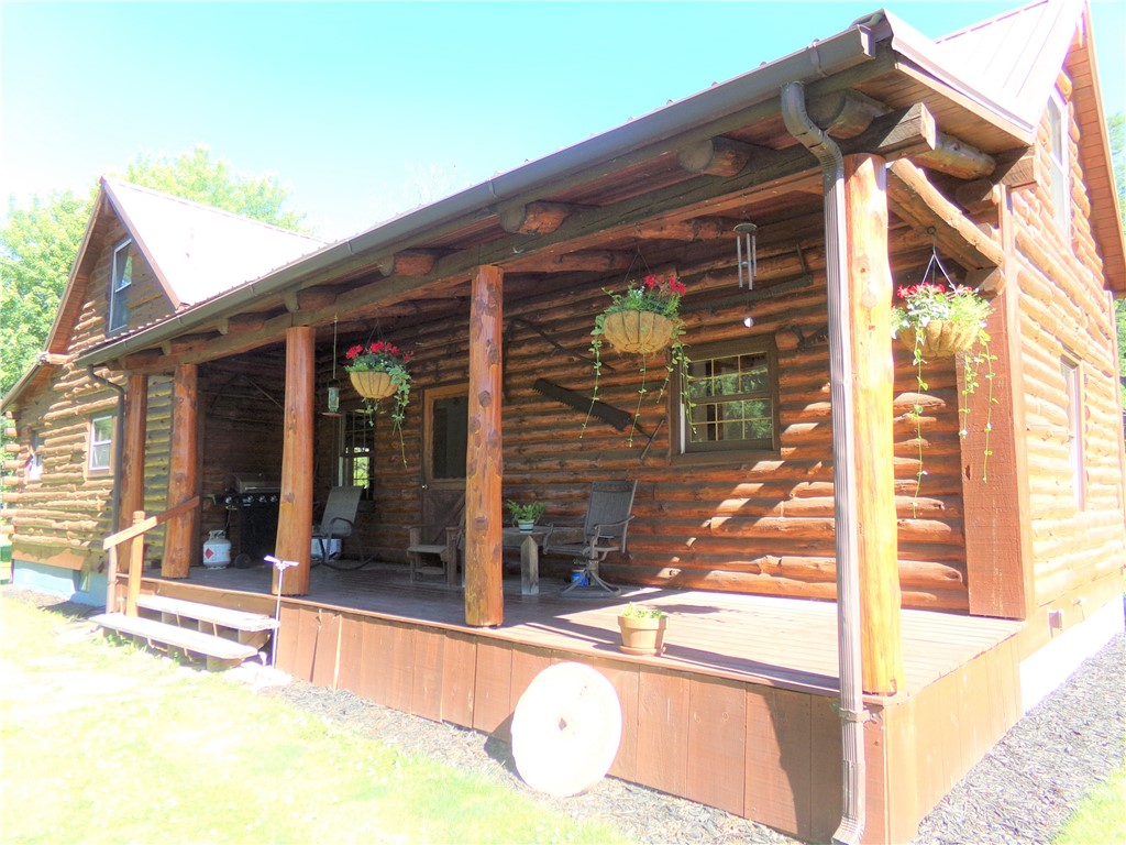 1921 County Line Road Kendall, NY 14476 - Photo 1 of 1 Beautiful shaded front porch faces yard and drivew