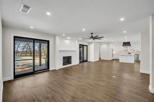 a view of kitchen and kitchen with furniture wooden floor and window