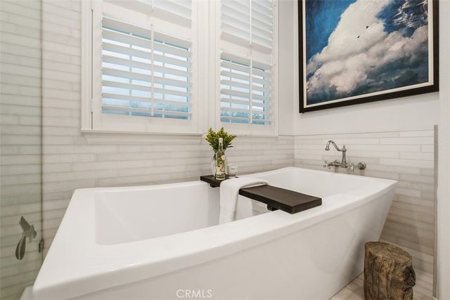 a bathroom with a bathtub and a sink
