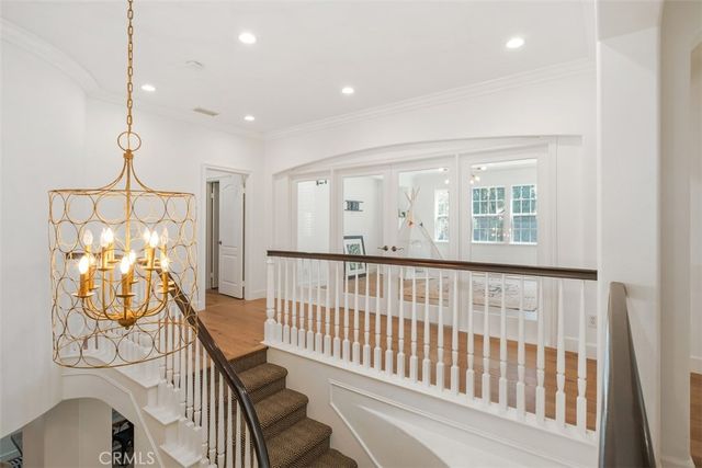 a view of a livingroom with wooden floor and a window