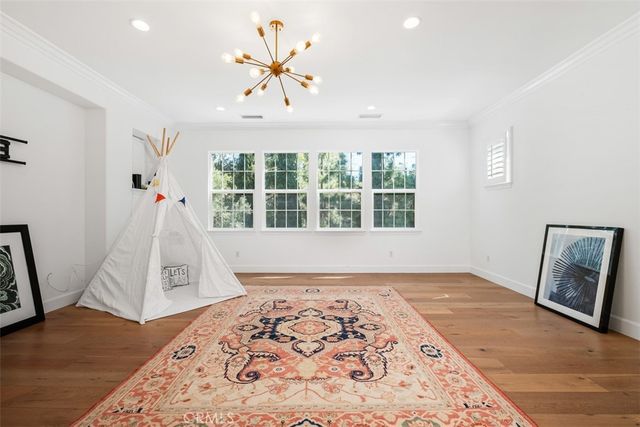 a bedroom with bed and a window