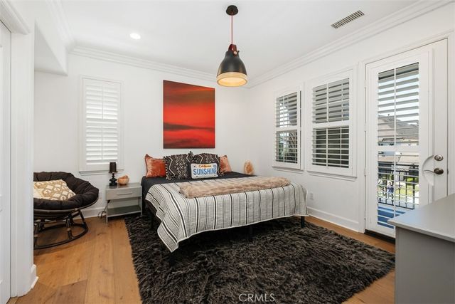 a view of a room with wooden floor and staircase