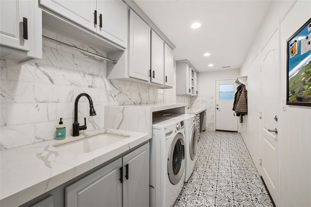 a view of a patio with table and chairs and potted plants