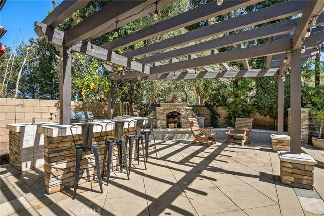 a view of a patio with table and chairs and potted plants