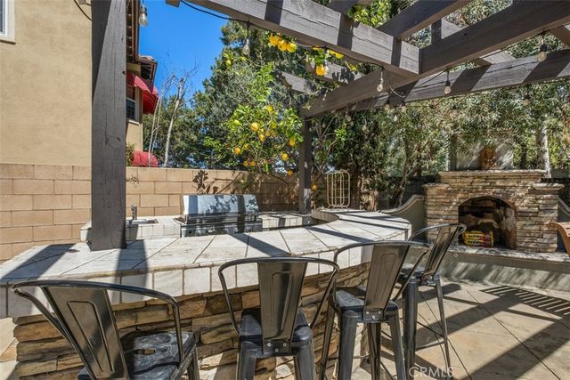 a view of backyard of house with outdoor seating