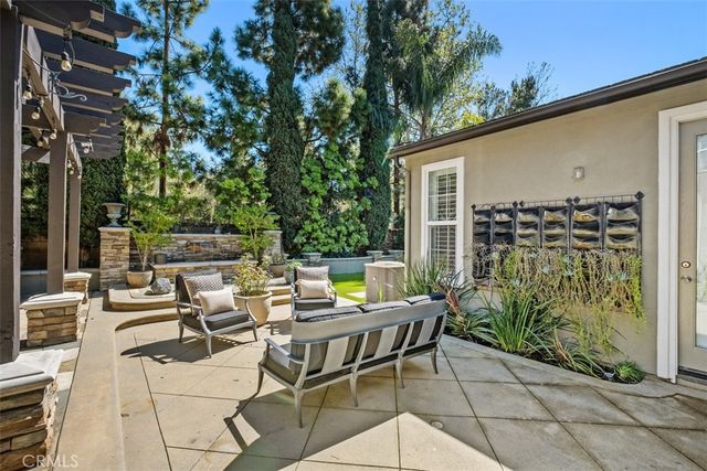 a view of a backyard with sitting area