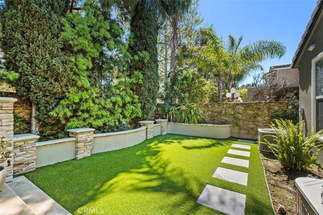 a view of a house with backyard porch and sitting area