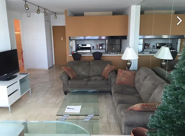 a view of a livingroom with furniture window and outside view